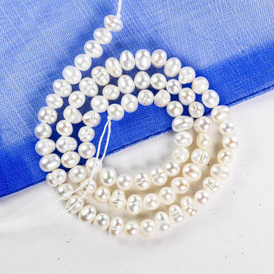 Freshwater pearl strand, white, 4.5*5-6mm potato shape, 14 inches, 0.8mm hole, about 80pcs pearl