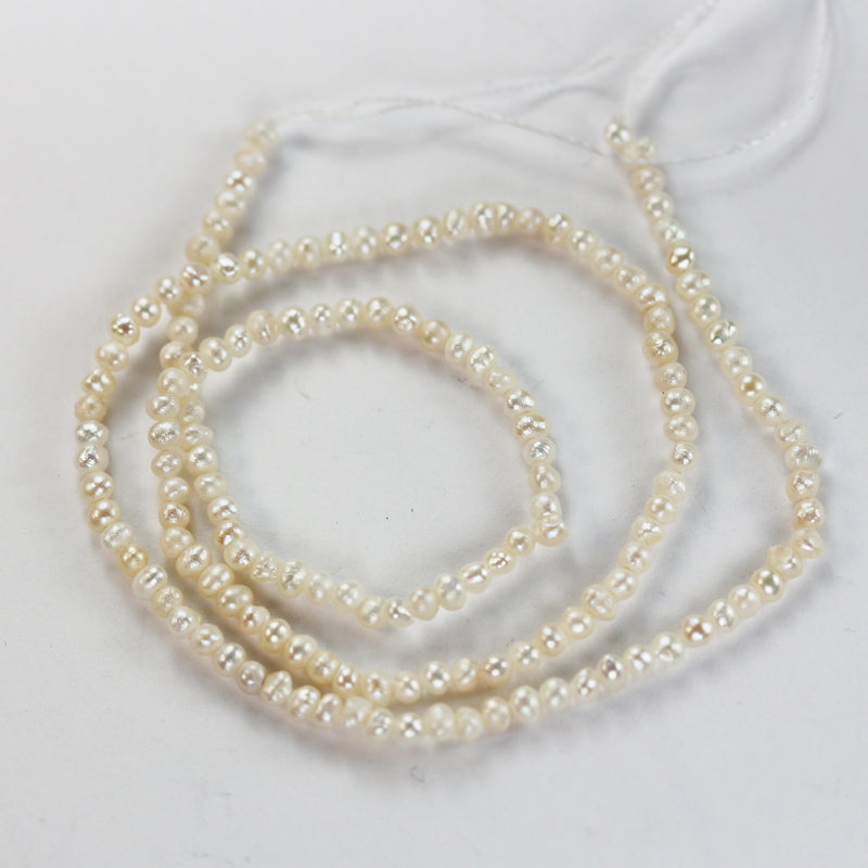 Freshwater pearl strand, white, 2.5mm potato shape, 14 inches, 0.5mm side drilled hole, about 150pcs pearl